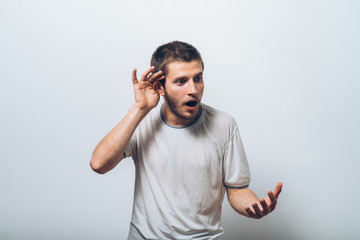 Overhears a man, tries to listen.