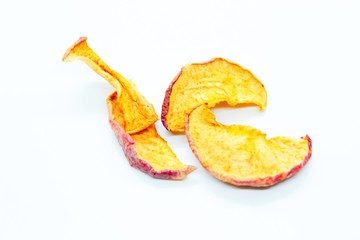 pieces of dry apples placed on a white background