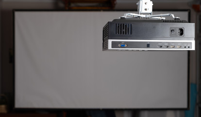 Media projector hanging on the ceiling