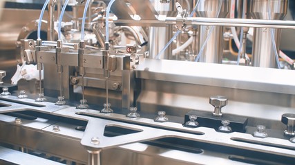 Medical vials on an automatic production line for filling vaccines and injections. coronavirus,