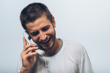 man talking on landline - 334444610