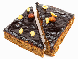 Cake with chocolate cream and nuts isolate.