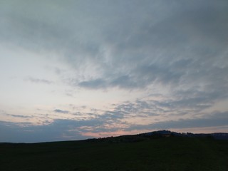 Sunrise or sunset over the hills and meadow. Slovakia