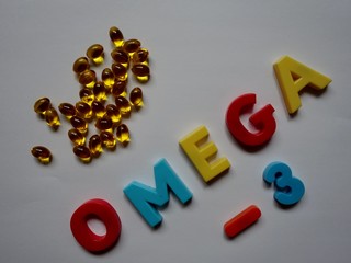 layout of yellow gelatin capsules filled with fish oil-omega 3