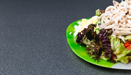 Ingredients for making salad on a green plate. © bearok