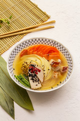 Korean noodle soup with smoked chicken and vegetables. Spring spicy dish for healthy meal