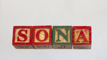 The term SONA isolated on a clear background using colored wooden toy blocks image in horizontal...