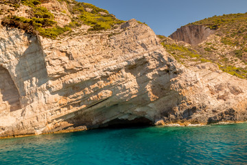 Fototapeta na wymiar Hidden Treasure Cave just around the corner from Navagio Shipwreck in midday sun