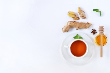 Ingredients for herbal ginger tea with honey, star anise and anise. Healthy food detox concept. Flat lay with space for text. Top view.