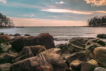 Scandinavian seascape. Waves and rocky coast. Finland. March 2020. Stylized photographs.