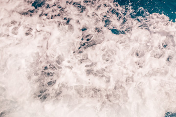 Whitewash from a tourist yacht as it passes from the back of the yacht