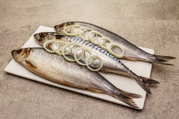 Pickled whole mackerel and herring. Traditional seafood delicacy, healthy eating concept