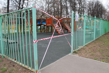 Fototapeta na wymiar The Playground is closed to visitors and games due to the epidemic. Quarantine due to the Ncov-19 coronavirus pandemic. Ban on leaving the house. Stay at home.