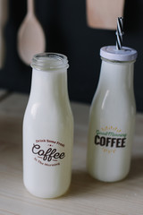 coffee milkshake. milk cocktail in a glass bottle. morning breakfast