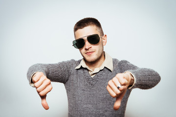 man showing a thumb down gesture