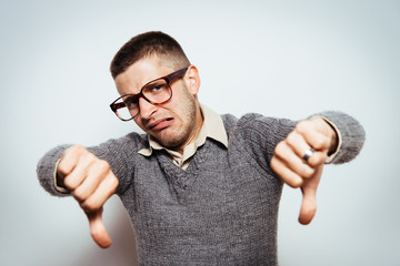 man showing a thumb down gesture