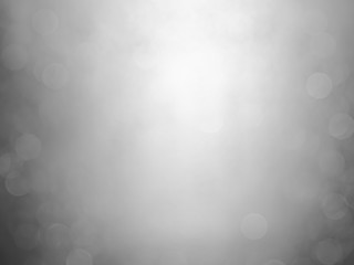 White and gray  bokeh background.Abstract blur background. White bubbles on a black background.