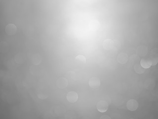 White and gray  bokeh background.Abstract blur background. White bubbles on a black background.
