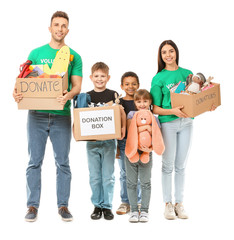 Volunteers with donations for orphans on white background