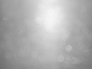 White and gray  bokeh background.Abstract blur background. White bubbles on a black background.