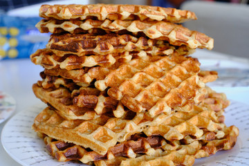 A pile of handmade sourdough waffles. Traditional breakfast concept. 