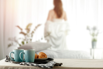 Spring morning at a wooden table in the moody sun with delicious coffee