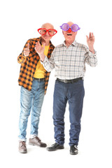 Portrait of elderly men with party decor on white background