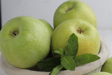fresh green apples in box