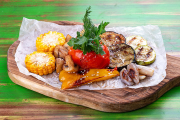 Grilled vegetables: corn, tomato, eggplant, zucchini, pepper and mushrooms. Vegetarian dish.