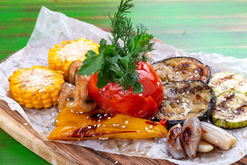 Grilled vegetables: corn, tomato, eggplant, zucchini, pepper and mushrooms. Vegetarian dish.