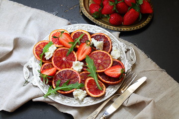 Salad with red oranges, cheese and arugula