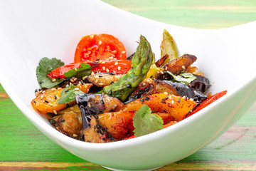 Eggplant Tempura with vegetables in Unagi sauce. Vegetarian dish.
