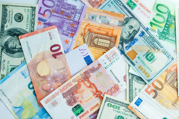 Fototapeta na wymiar background of money. paper euros, rubles, and dollars. The concept of difference and uniformity of money. For financial journals and articles