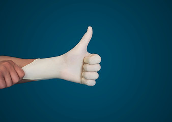 Doctor hand with glove showing like gesture or thumb up as approval, accept or done concept