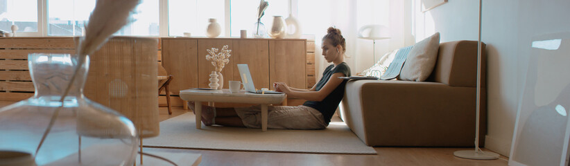 Caucasian female working from home, having a video work call, making notes. Stay home, quarantine remote work