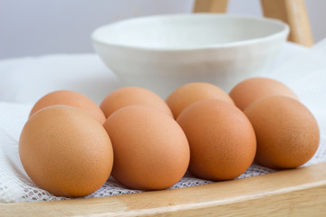 eggs on wood table on white background
