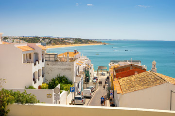 View of beautiful Albufeira with white architecture and sandy beach, Algarve, Portugal