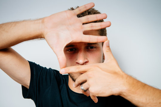 Man Framing Face With His Hands