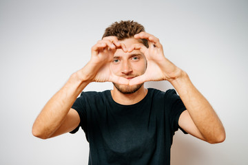 Fototapeta premium man making a hand heart frame