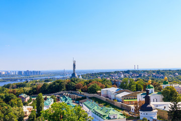 Fototapeta premium View of Kiev Pechersk Lavra (Kiev Monastery of the Caves), Motherland Monument and the Dnieper river in Ukraine. View from Great Lavra Bell Tower