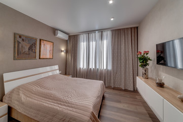 Interior of the apartment in a contemporary style. Bedroom