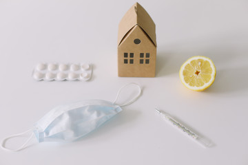 Seasonal allergic rhinitis or flu. Protective mask, pills, thermometer. Healthcare concept. Coronavirus COVID-19 background