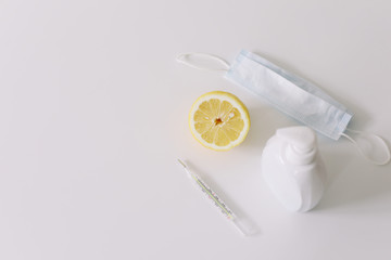 Tools for preventing the spread of virus. Protective mask, vitamins, pills, mercury thermometer. Coronavirus COVID-19 background