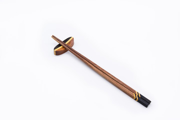 Isolated of Wooden chopsticks on chopstick rest