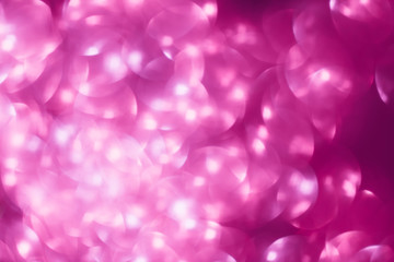 Shimmering blur spot light on pink color background, Christmas concept