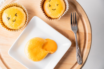 cake with Lava Salted Eggs on wooden plate food concept background.