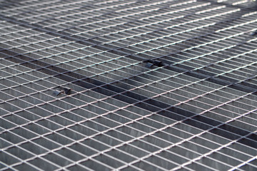 Shadow on a metal grid