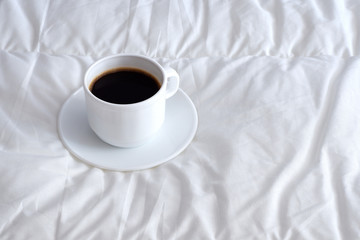 coffee on the duvet cover. Interior. Minimalism. Coziness. Beautiful background