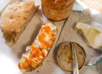 Home made bread with butter and apricot jam