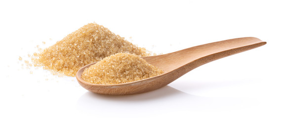 brown sugar in wood spoon on white background